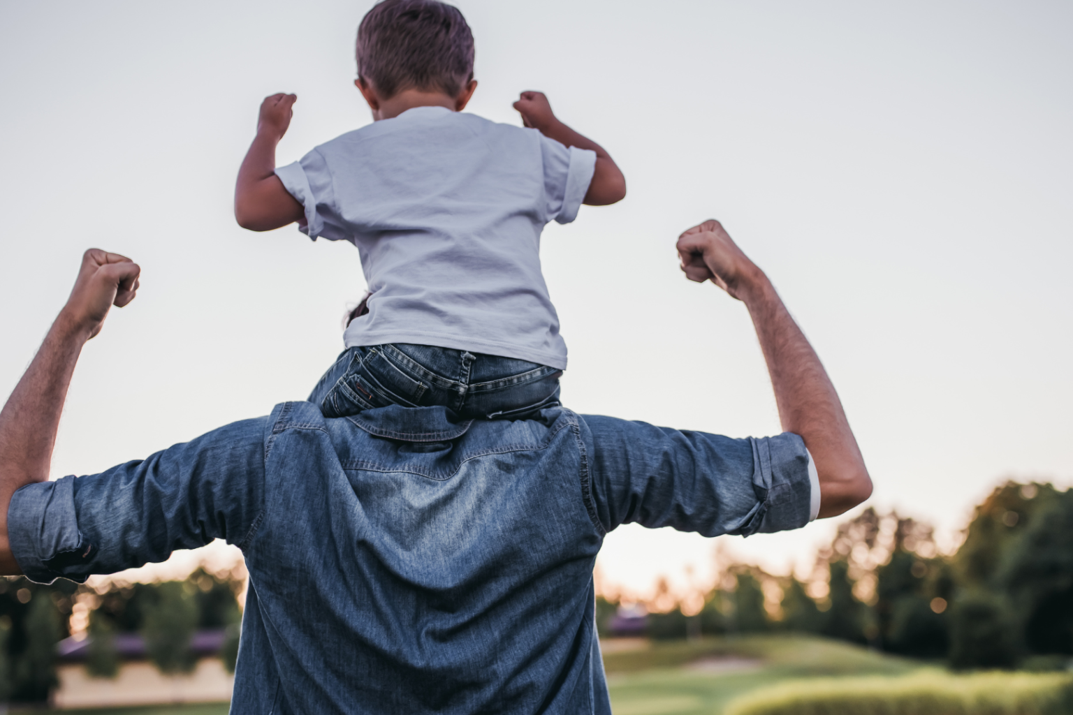 Father with child on his shoulders