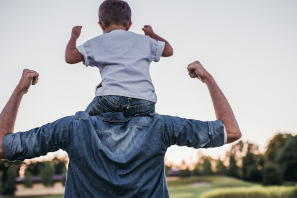 Father with child on his shoulders