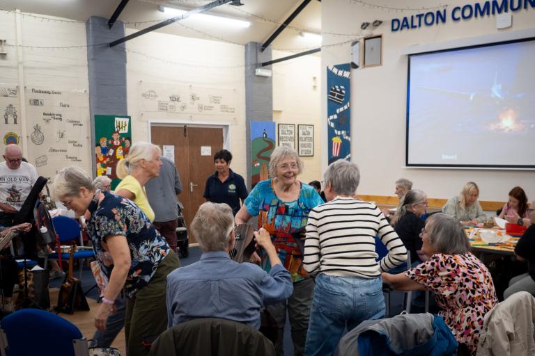 A community group gathering in a community hall.