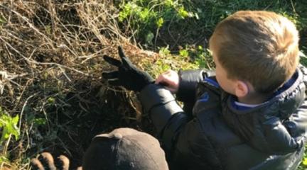 Two boys exploring the heritage of Ormsgill Quarry