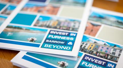 Leaflets on a table, saying "Invest in Furness."