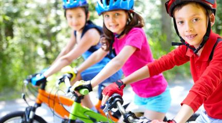 Three children on bicycles.