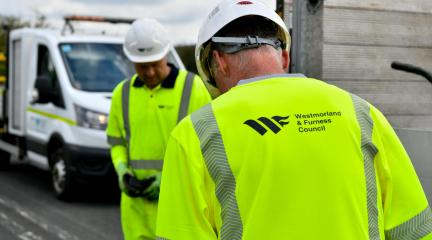 highways staff working on a road