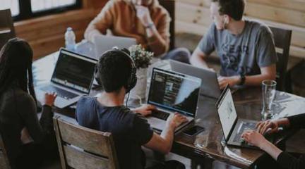 People working at desks in an enterprise hub