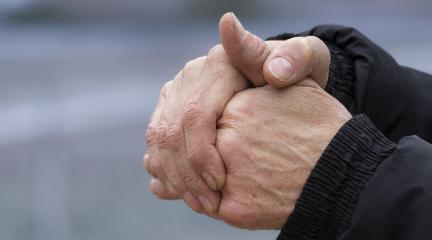 A person clasping their hands