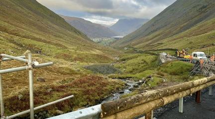 View of down the valley of Kirkstone Pass with the wooden-clad barriers being installed