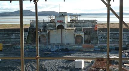 A derelict diving platform viewed through scaffolding poles