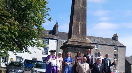 The official party on the steps of the Obelisk in Broughton in Furness.