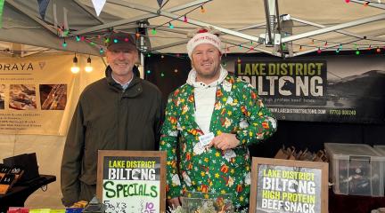 Jonathan Harris, programme director for Connecting Cumbria, and Bryan Mol of Lake District Biltong at his stall at Bowness Glebe Market.