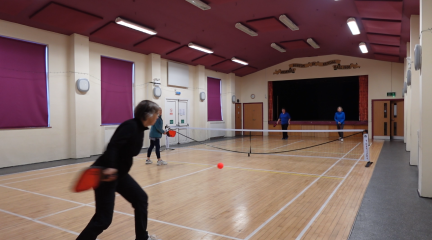 People playing pickleball.