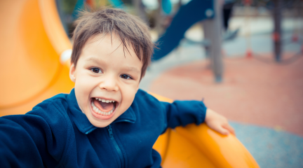 A kid playing at a playground