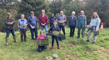 A group of volunteers from a Planting for Pollinators planting day.