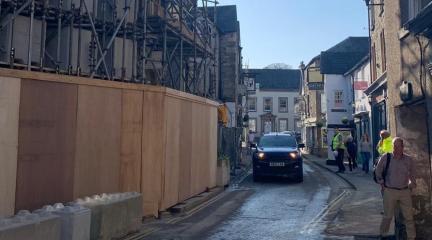 A car driving through Market Street.