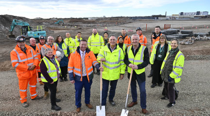Representatives of Westmorland and Furness Council, Homes England, Redstart Northwest Ltd and Team Barrow at the Marina Village site to mark the start of phase two of ground remediation.