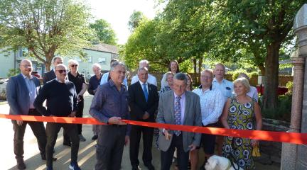 Stuart Johnstone cutting the ribbon at the opening of SIlver Street Memorial Garden.