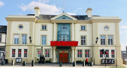 Coronation Hall in Ulverston decorated with red poppies - image created in Photoshop