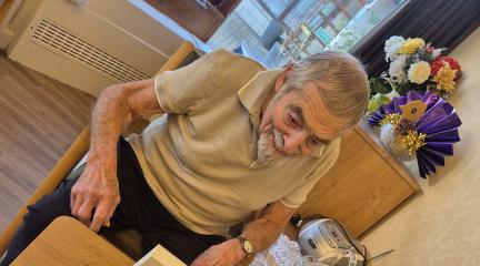 A man sitting at a desk talking into a Portal.