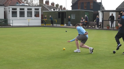 People playing crown green bowls at the King Alfred Bowling Club