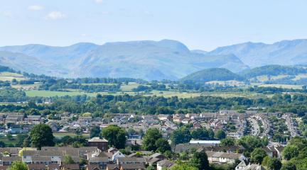 Houses in Penrith with the Lake District hills in the background