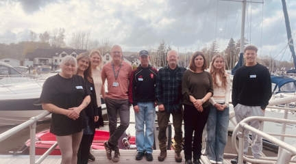 A group photograph of the team from the Windermere Marina Village and the Council's Skills Bridge Tutor, Peter Harrison, after completing the Level 1 Mental Health & Wellbeing Course