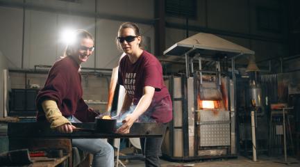 Two women working in a workshop.