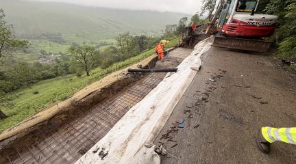 Contractors working on the repairs on the A592 landslip at High Kingate