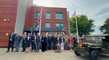 Armed Forces Week flag raising event outside Voreda House
