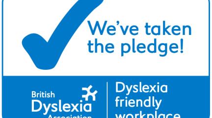 Badge reading We've taken the pledge! Dyslexia friendly workplace, British Dyslexia Association