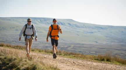 Two walking along a path.
