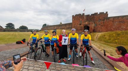 Cyclists pictured at Carlisle Castle ahead of charity cycling challenge