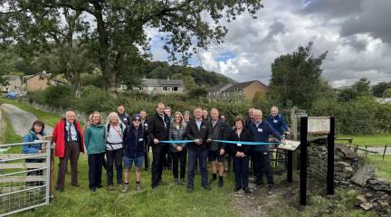 Westmorland and Furness Council leader Councillor Jonathan Brook and Cabinet member for Environmental Services and Transport, cut the ribbon to launch the new Westmorland and Furness Way along with guests