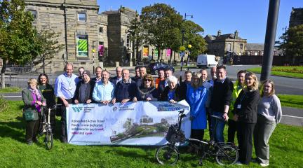 Olympic gold-medal-winner Chris Boardman CBE,  the National Active Travel Commissioner for Active Travel England, pictured with guests at the launch event of the new Abbey Road walking, wheeling and cycling route on Wednesday, including local councillors and representatives from Active Travel England,  Brilliant Barrow and Team Barrow.