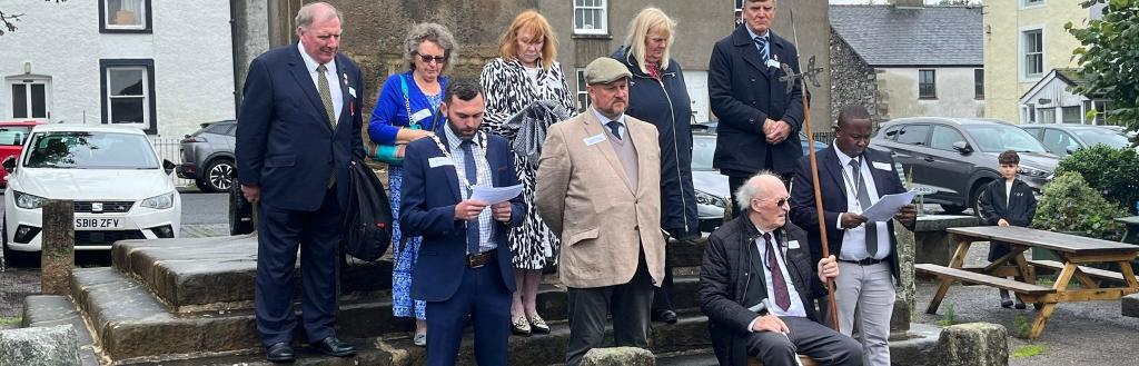 The official party on the steps of the Obelisk in Broughton in Furness