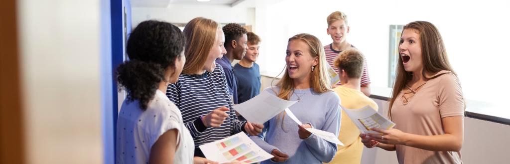A group of students looking at their exam results
