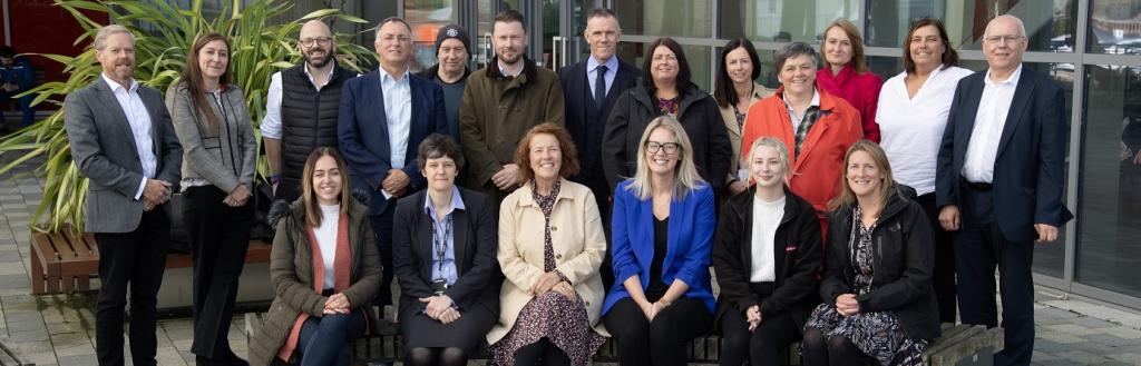 Members of the Brilliant Barrow board at the campus site.