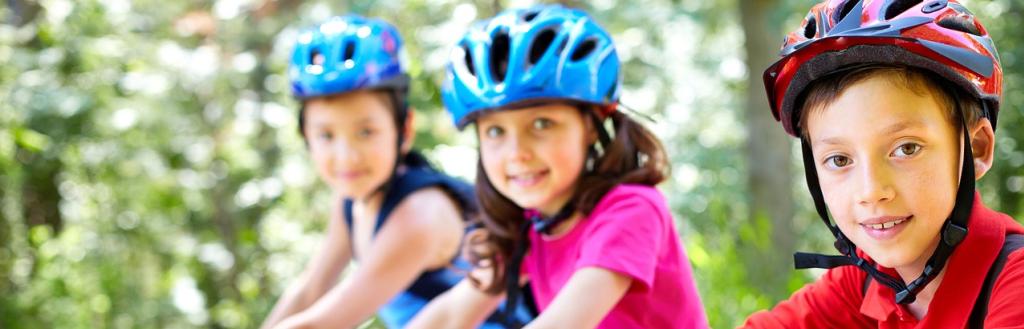 Three children on bicycles.