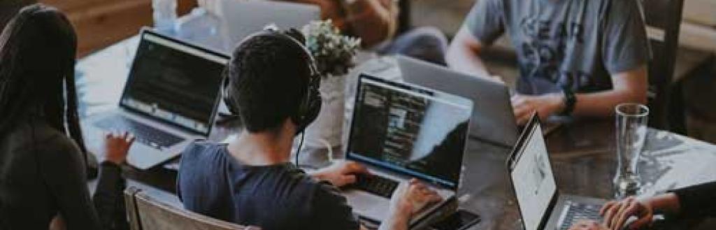 People working at desks in an enterprise hub