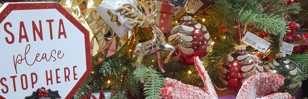 A yoga mat beside a Christmas tree
