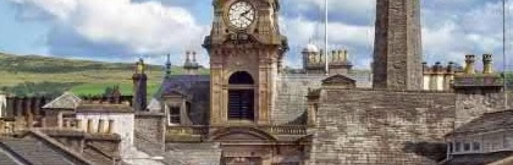 Kendal Town Hall, with blue sky and clouds in the background.