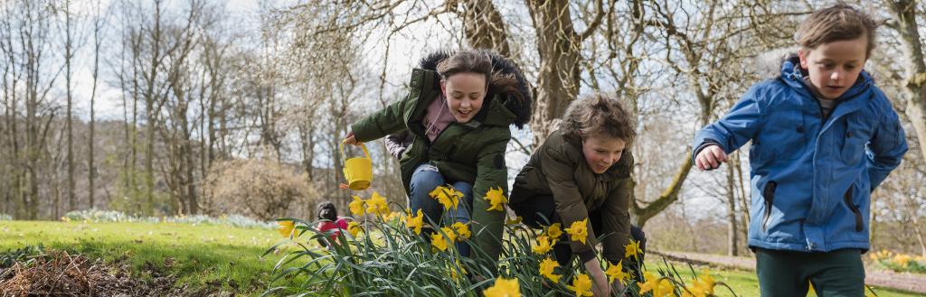 children hunt for eater eggs outside