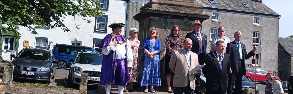 The official party on the steps of the Obelisk in Broughton in Furness.