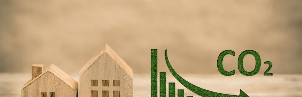 Image to show buildings with a graph and reducing CO2 emissions