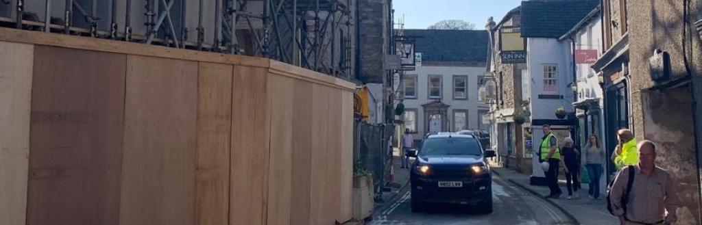 A car driving through Market Street.