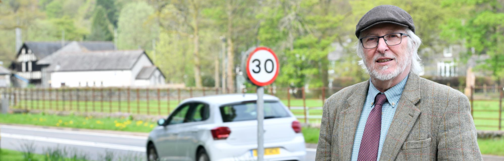 Cllr Peter Thornton, Cabinet Member for Highways and ICT stood on a Patterdale Road that was included in year one of the 20mph programme.