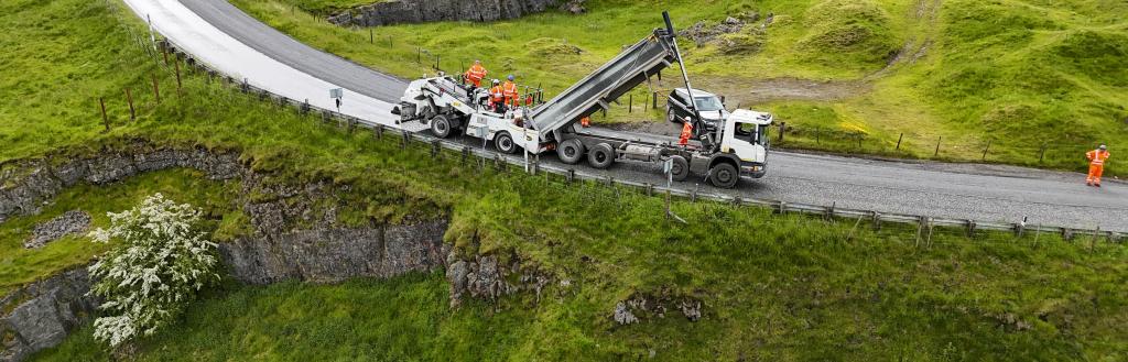 Highways wagon completing surface dressing on a rural road