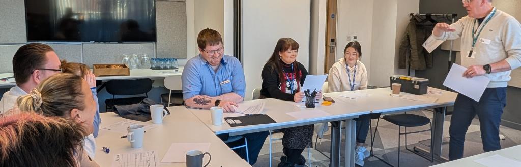 Learners in the classroom on an adult education course in Cumbria