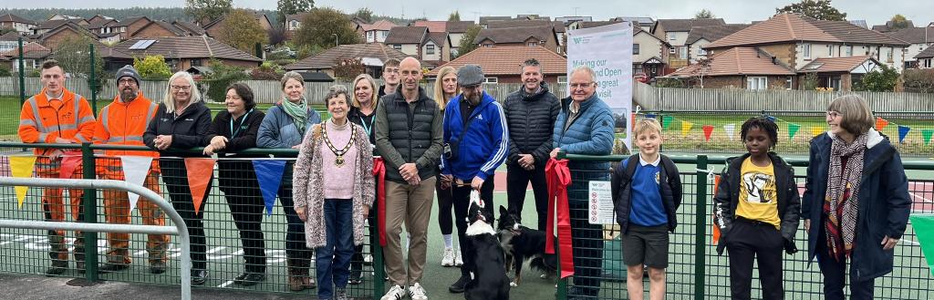 A group of people at the opening of the new Multi-Use Games Area at Carleton Park, Penrith
