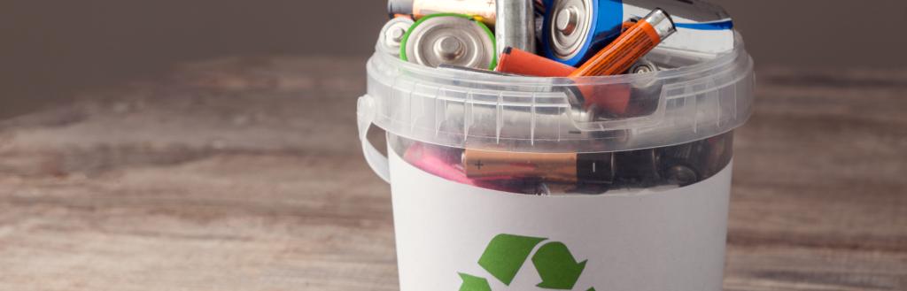 A container full of used batteries for recycling.