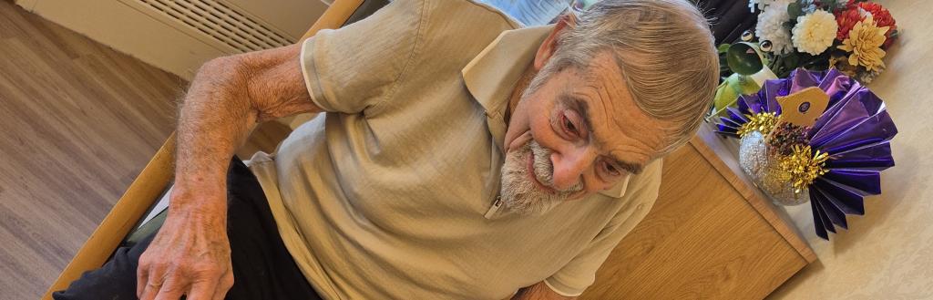 A man sitting at a desk talking into a Portal.