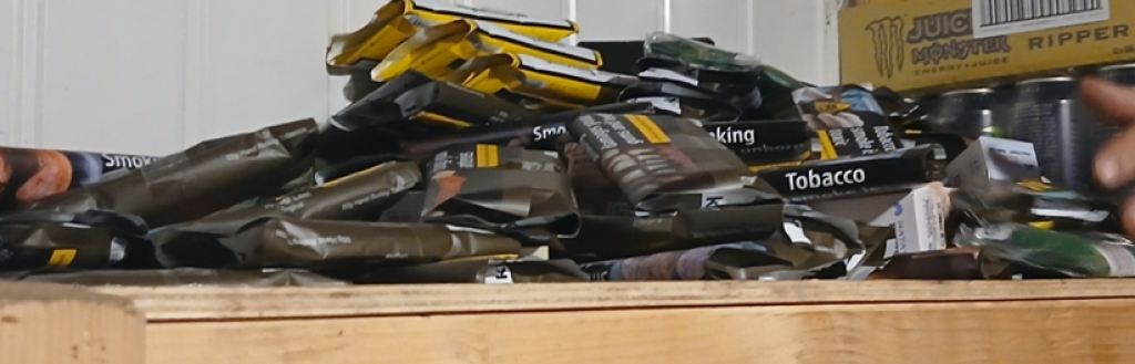 A pile of tobacco on a garage shelf that was seized 